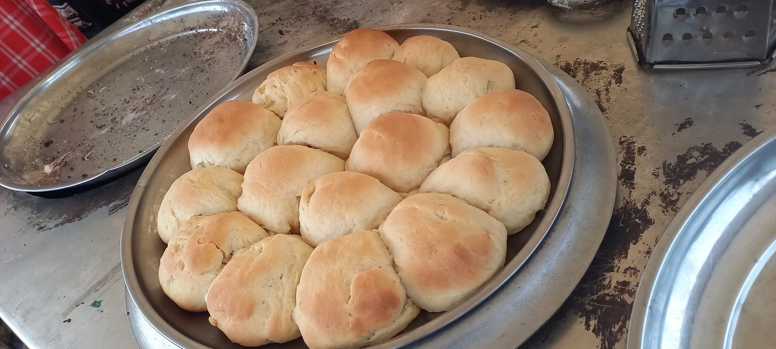 Tray of baked bread rolls
