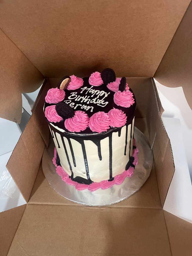 Pink and black Oreo drip cake